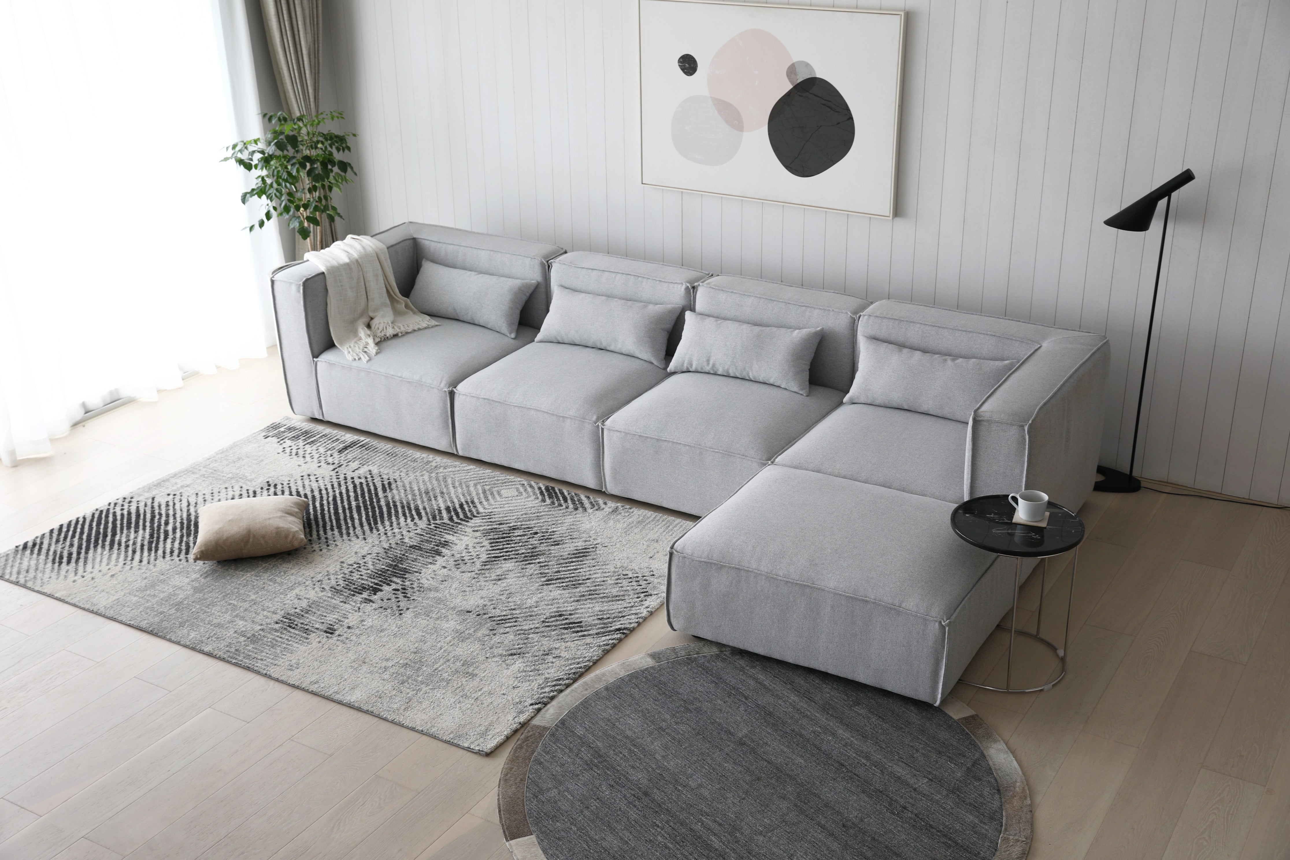 Sofá modular 4 plazas con puff tejido gris