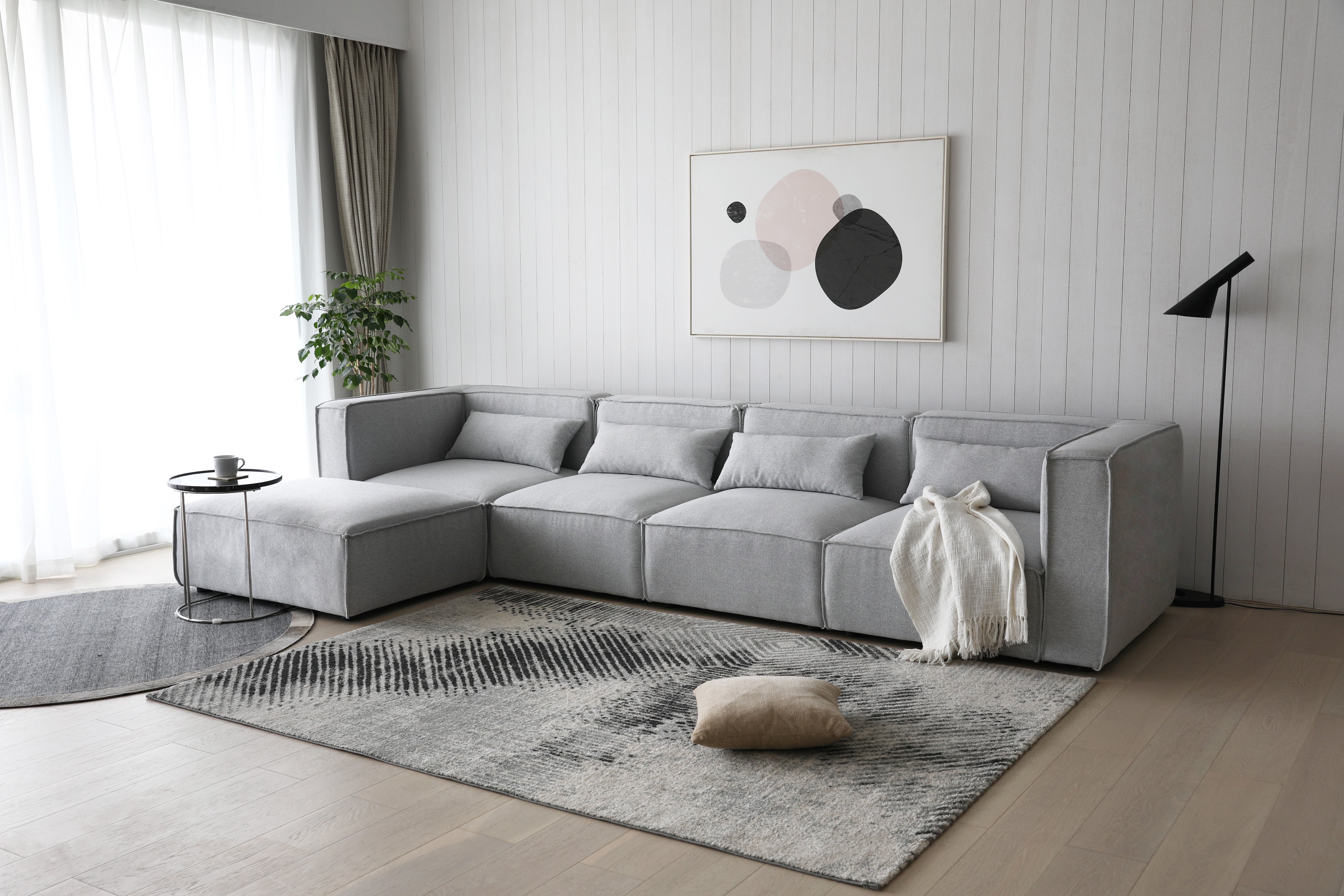 Canapé modulable 4 places + pouf gris